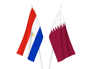 National fabric flags of Qatar and Paraguay isolated on white background. 3d rendering illustration.