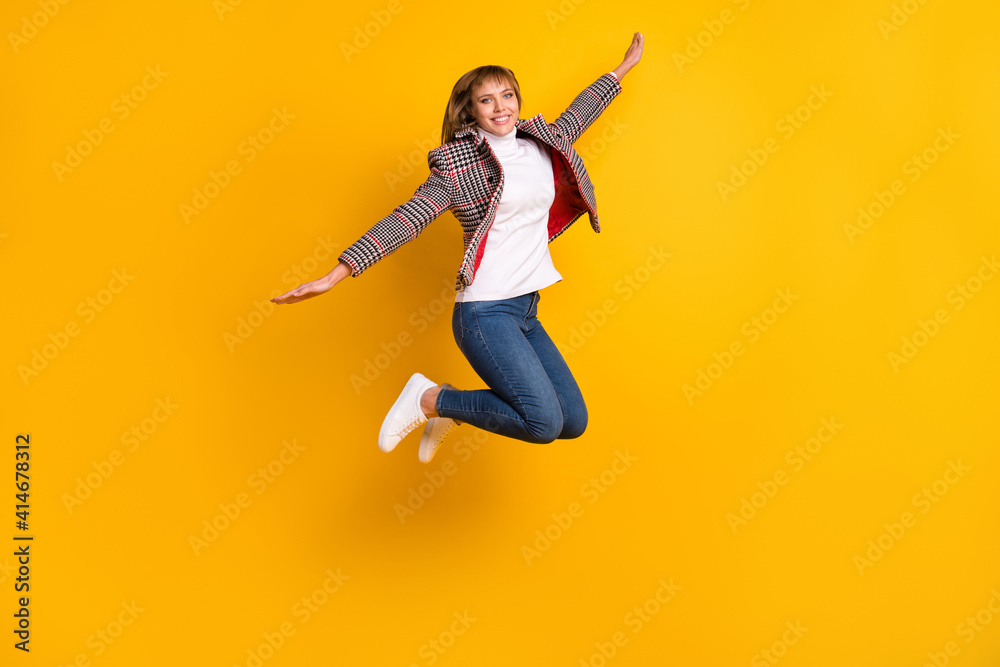 Poster full size photo of pretty cheerful girl raise arms flying beaming smile look camera isolated on yell