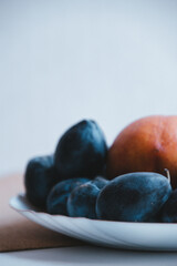 plums in a bowl