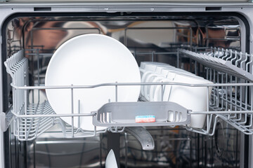 New dishwasher. Built-in dishwasher in kitchen