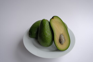 ripe avocado. green avocado on white background