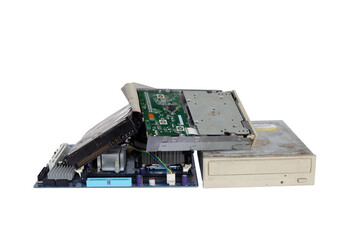 Pile of electronic waste, Rusty old and obsolete computer hardware such as motherboards and CD-ROMs, floppy disk isolated on white background