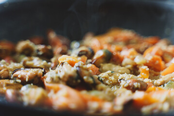 Cooking of traditional Moroccan couscous with mussels.