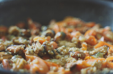 Cooking of traditional Moroccan couscous with mussels.