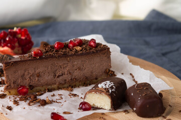 Chocolate treat chocolate cheesecake with chocolate chips truffles coconut bar and pomegranate seeds is perfect for tea and coffee.