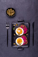 Sandwich with beetroot sauce and egg