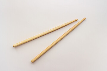 Two wooden drum sticks, top view. Music background