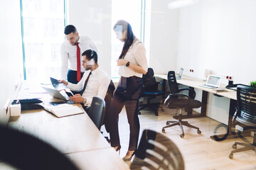 Diverse colleagues discussing plans in office