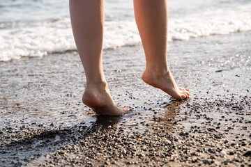 nice legs of a pretty girl walking in water