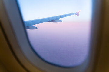 Fototapeta na wymiar Wing of an airplane in the sunset
