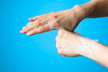 Fototapeta premium Cleanning hands with soap to prevent bacteria or viruses. Cleanliness and body care concept.