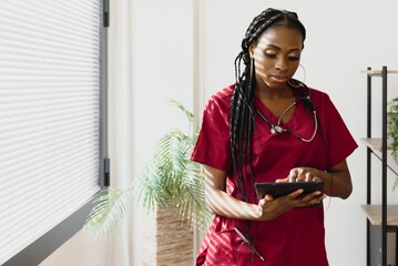medicine, people and healthcare concept - african american female doctor or nurse at hospital