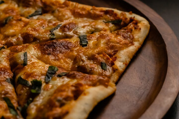 beautiful photography of yummy margherita pizza on wooden plate.