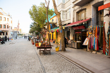 Naklejka premium Romantic Istanbul Sunset Landscape. Beautiful street life in Istanbul. Colored cafe.