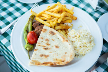 A delicious doner donair kebab wrap with meat.