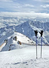 Fotobehang Ski sticks with gloves at the top of Gaislachkogel near Solden in Otztal Alps in Tirol, Austria © kilhan