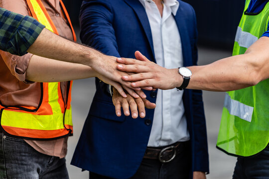 Worker hands touching teamwork with unity