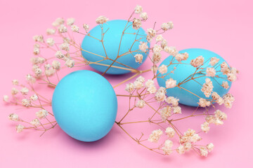 Easter eggs blue on a pink background