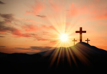 Christian crosses on hill outdoors at sunset.  Crucifixion Of Jesus - obrazy, fototapety, plakaty