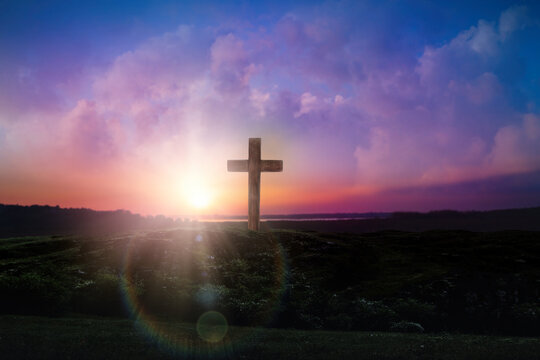 Christian cross outdoors at sunrise. Resurrection of Jesus
