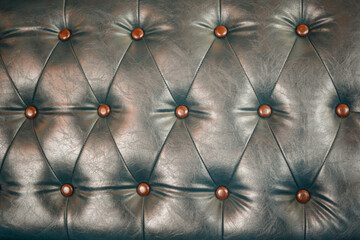 Leather of sofa buttoned of textured background