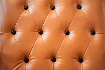 Leather of sofa buttoned of textured background