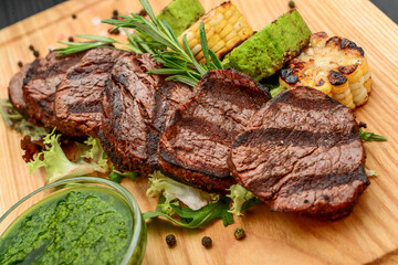 Grilled beefsteaks on cutting board - dinner preparation
