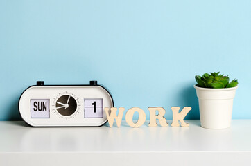 Concept of work items on the table on a blue background. Place for text.