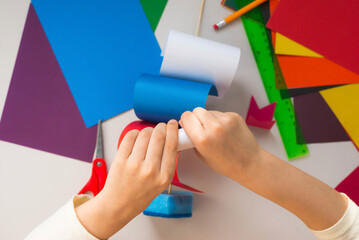 Girl Kid makes Baby Girl makes Crafts from Colored Paper and Sponge Crafts from Colored Paper and...