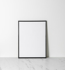 Photo or poster empty frame mock up on marble table