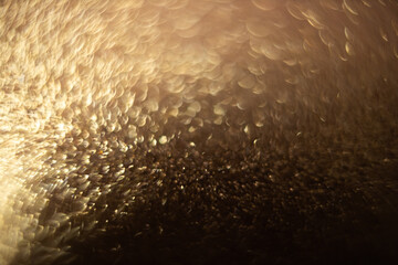 abstract gold glitter background bokeh. Elegant gold background with glitter sparkle bokeh. defocus