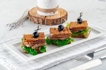 Catering Pork Sandwiches on a white plate, copy space
