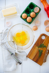Mise en place for omelet on a white surface