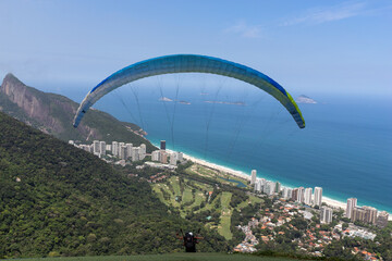 Takeoff of a paraglider to fly over the beach