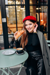 Girl drinking coffee in the cafe.