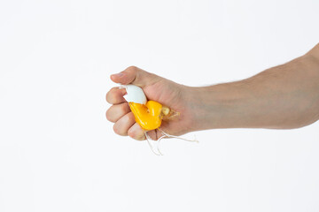 Brocken fresh egg in hand