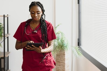 medicine, people and healthcare concept - african american female doctor or nurse at hospital