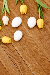 white chicken egg spring flowers wooden background Copy Space
