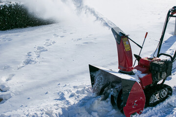 Tracked snow blower at work. After heavy snowfalls, snow is removed everywhere.