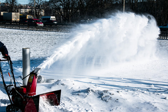 Tracked snow blower at work. After heavy snowfalls, snow is removed everywhere.
