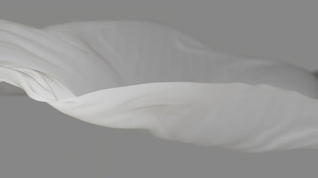 4k White wave satin fabric loop background.Wavy silk cloth fluttering in the wind.tenderness and airiness.3D digital animation of seamless flag waving ribbon streamer riband.