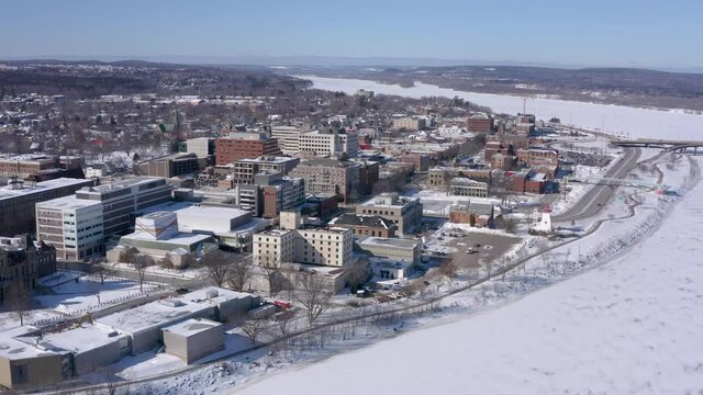 AERIAL: Rotating High Above Downtown Fredericton On Sunny Winter Day