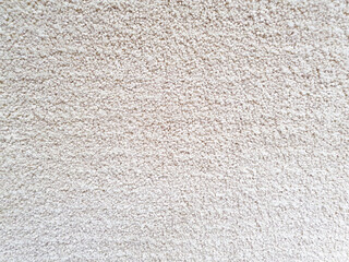 Gray long pile carpet texture background. Polypropylene long pile carpet, close-up, top view