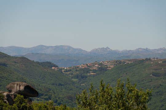 View of Geres national park mountains with a village on the foreground in Fafe, Portugal
