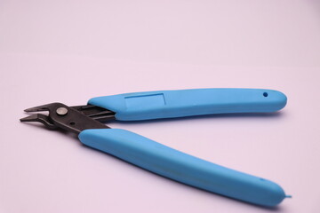 Filament cutter with rubber handle on white background. wire stripper used to cut filament from 3D printer isolated on white background