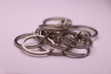 Fototapeta premium Closeup of split keyring with chain on white background