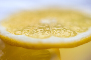 Juicy yellow lemon on white in close-up