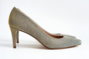 Women silver glitter stylish heel shoes on white background.