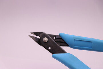 Filament cutter used to cut filaments from 3d printer. 3d printer accessories. Filament strippers with rubber handle isolated on white background