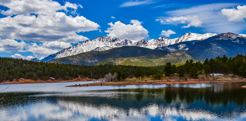 Panorama Snow-capped and forested mountains near a mountain lake, Pikes Peak Mountains in Colorado...